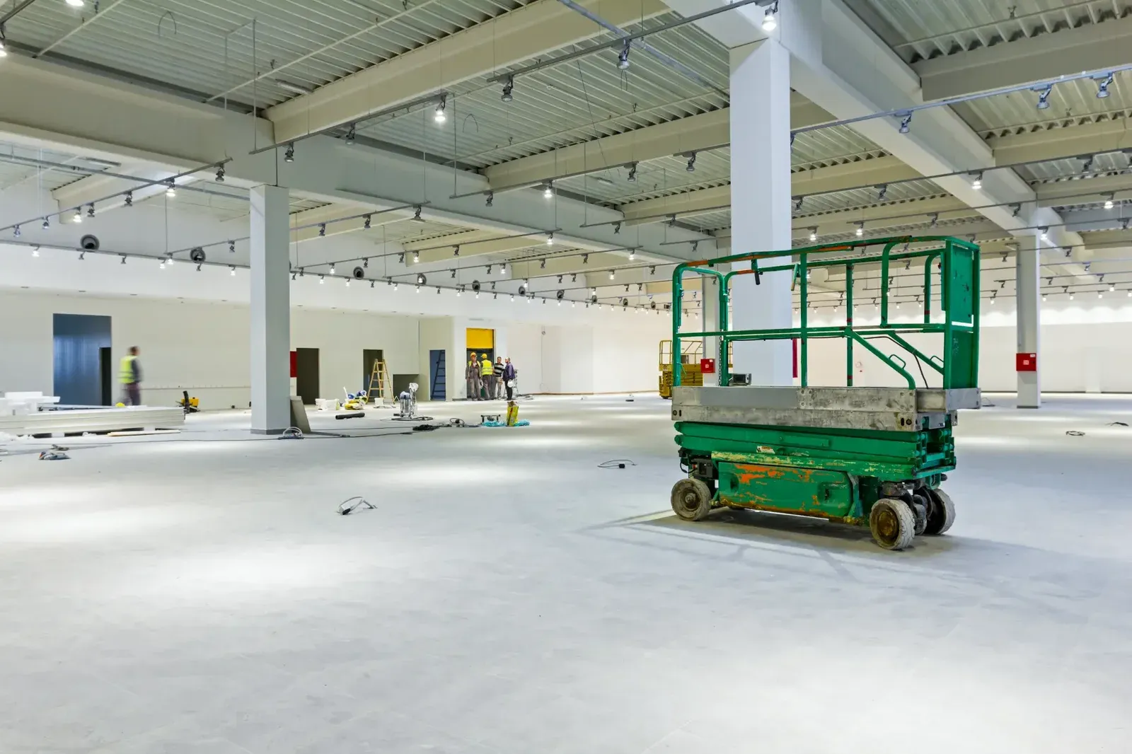 Commercial make good team working in large Melbourne warehouse space