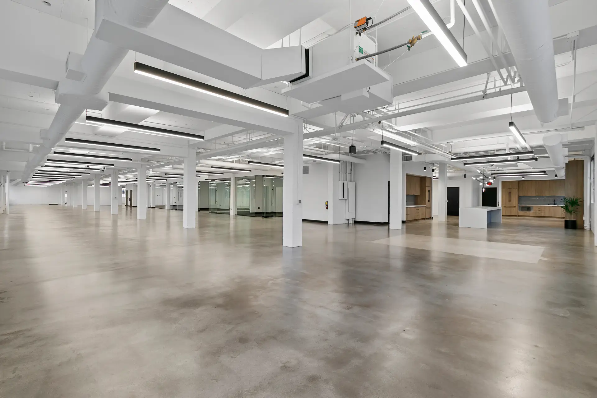Completed commercial office make good with polished concrete floors and exposed ceiling services in Melbourne