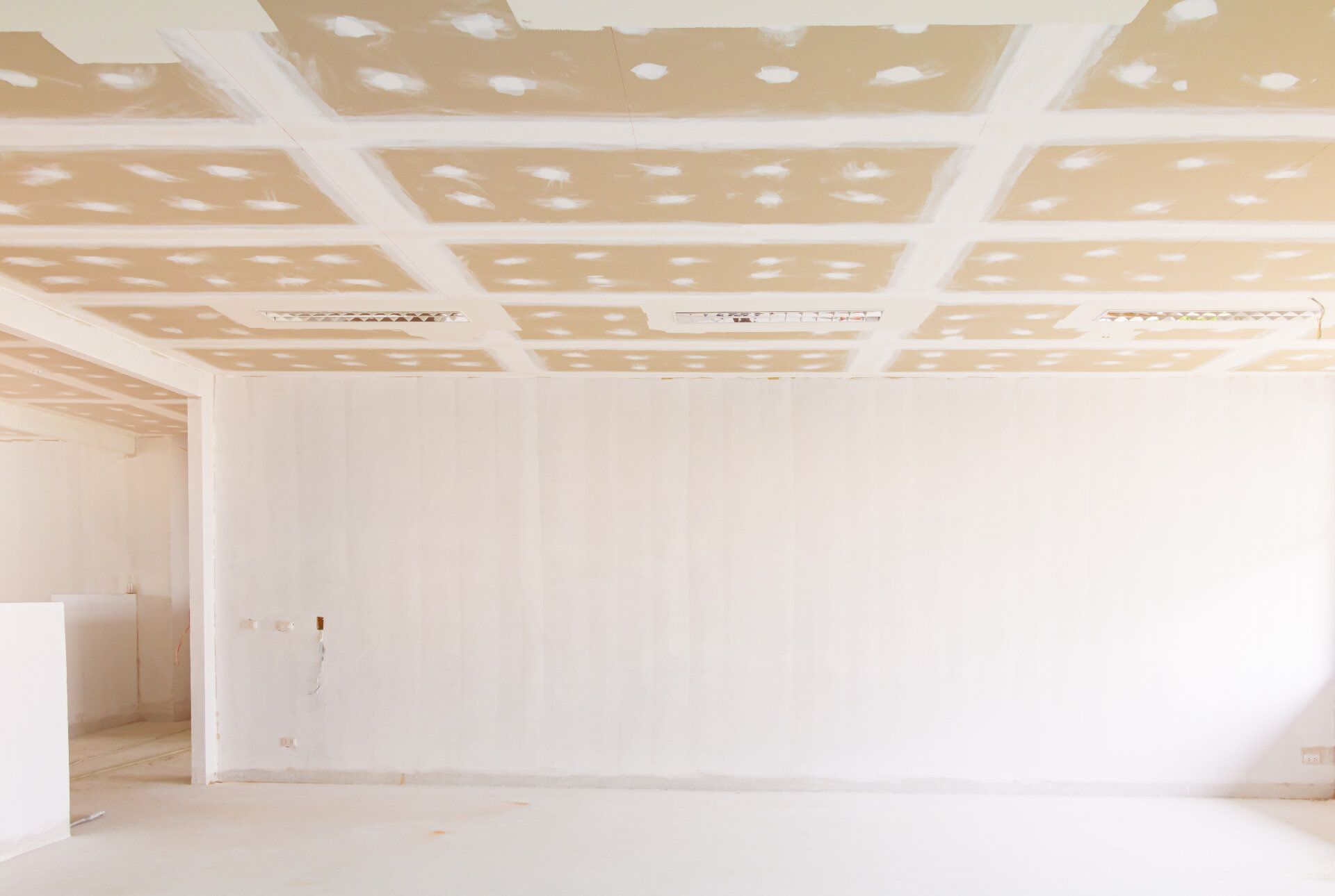 Commercial interior with plastered walls and ceiling surface preparation ready for professional painting in Melbourne
