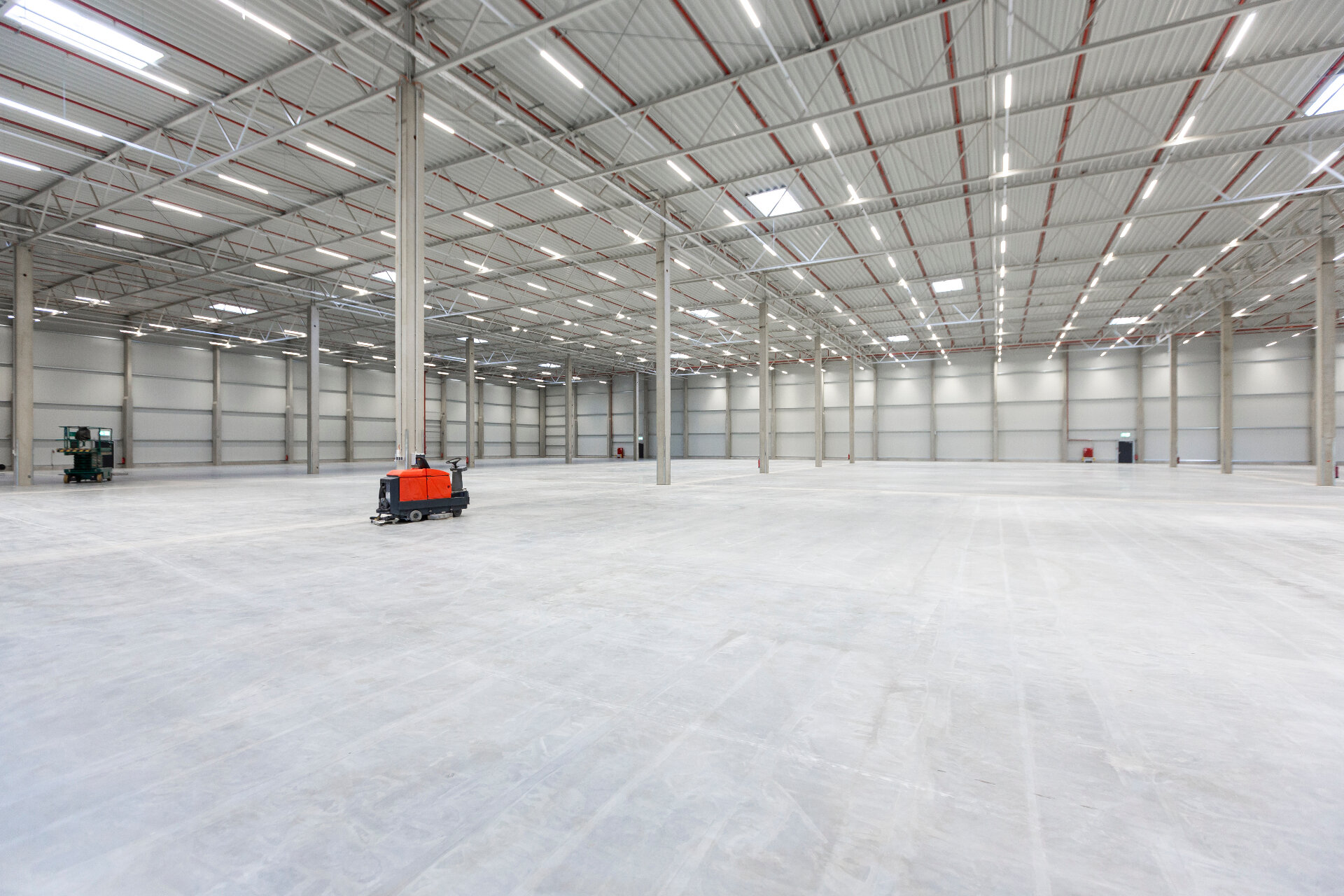 Large industrial warehouse with restored concrete slab floor showing completed floor restoration Melbourne