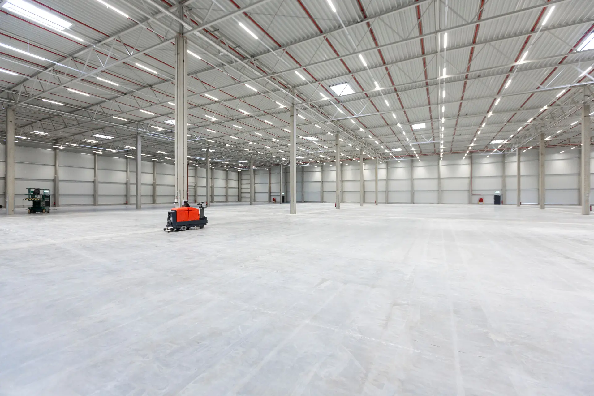 Large industrial warehouse with restored concrete slab floor showing completed floor restoration Melbourne
